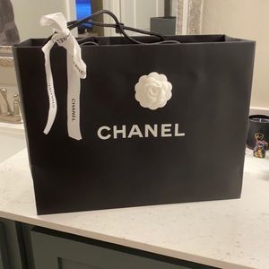 Chanel shopping bag with ribbon and flowers